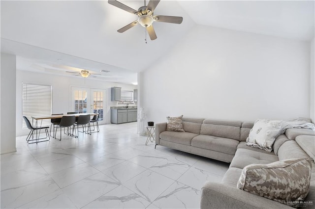 living room featuring high vaulted ceiling, french doors, and ceiling fan