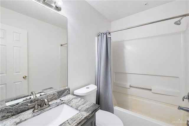 full bathroom featuring vanity, shower / bath combination with curtain, and toilet