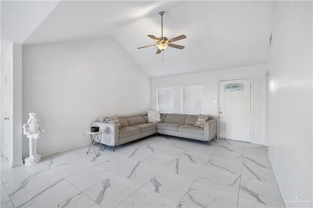 unfurnished living room with ceiling fan and high vaulted ceiling