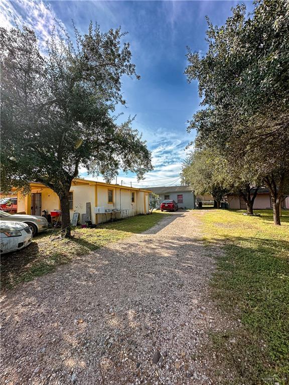 233 W 4th St, La Joya, TX 78560 - view of front of property with driveway and a front yard