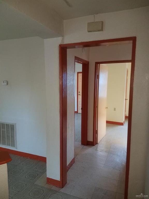 233 W 4th St, La Joya, TX 78560 - corridor featuring baseboards and light flooring