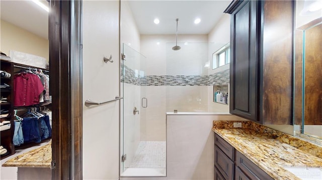 bathroom featuring vanity and walk in shower