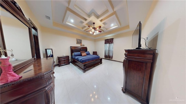 bedroom with beamed ceiling, a barn door, and coffered ceiling