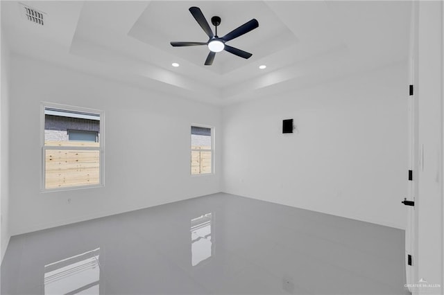 3433 E Kidd Ave, Edinburg, TX 78542 - spare room featuring a raised ceiling, a ceiling fan, and recessed lighting
