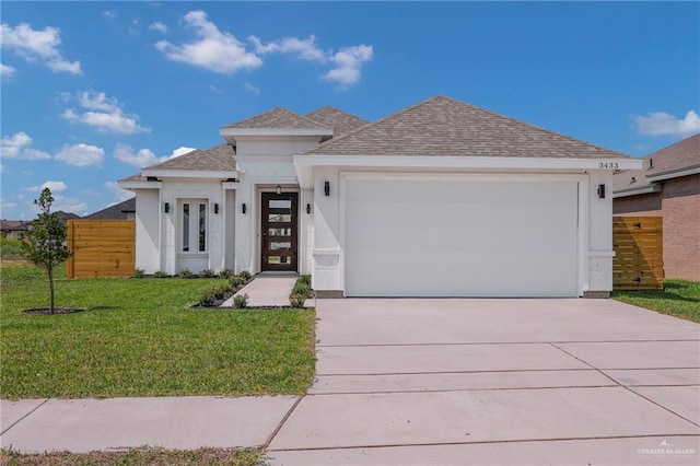 3433 E Kidd Ave, Edinburg, TX 78542 - view of front of home with a garage, roof with shingles, concrete driveway, and stucco siding