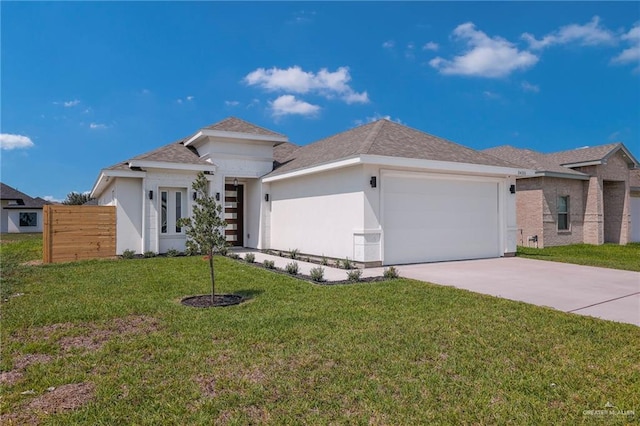 3433 E Kidd Ave, Edinburg, TX 78542 - prairie-style home featuring an attached garage, concrete driveway, stucco siding, and roof with shingles