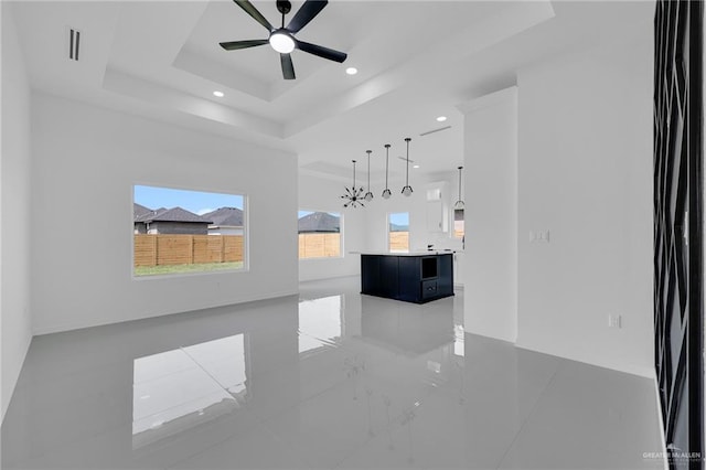3433 E Kidd Ave, Edinburg, TX 78542 - unfurnished living room featuring a tray ceiling, ceiling fan, recessed lighting, and baseboards
