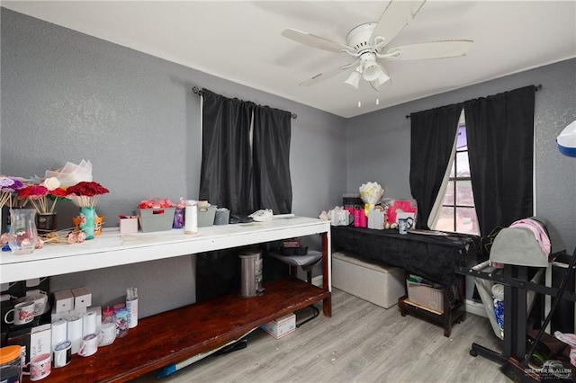 interior space with ceiling fan and light wood-type flooring