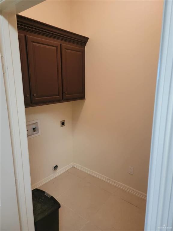 laundry area featuring cabinets, hookup for a washing machine, and electric dryer hookup