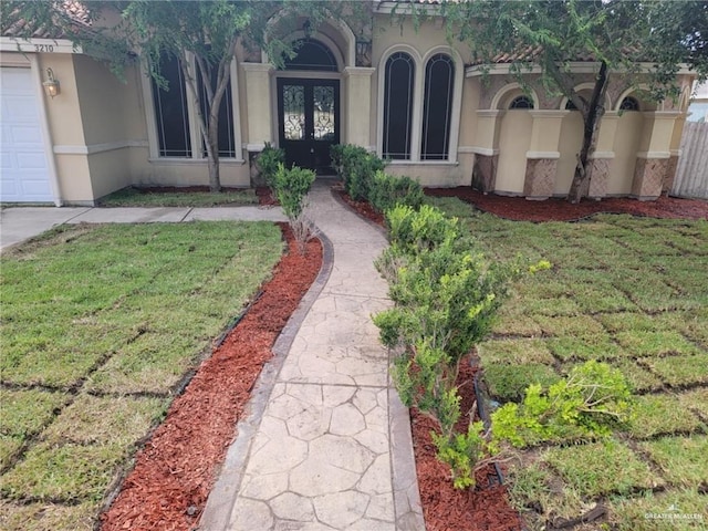 doorway to property with a yard