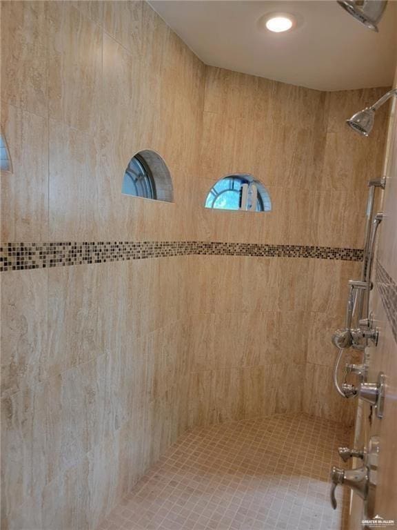 bathroom with a tile shower