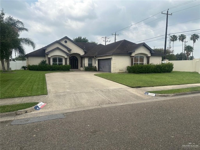 5845 Acacia St, Harlingen, TX 78552 - view of front of property with a garage, brick siding, and concrete driveway