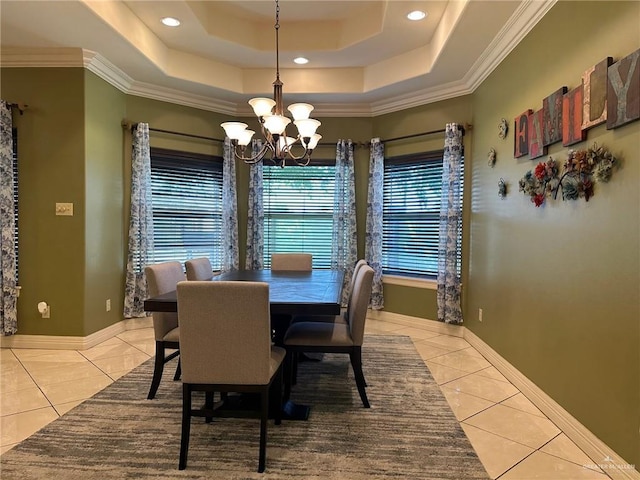 5845 Acacia St, Harlingen, TX 78552 - tiled dining area with a chandelier, baseboards, crown molding, a raised ceiling, and recessed lighting