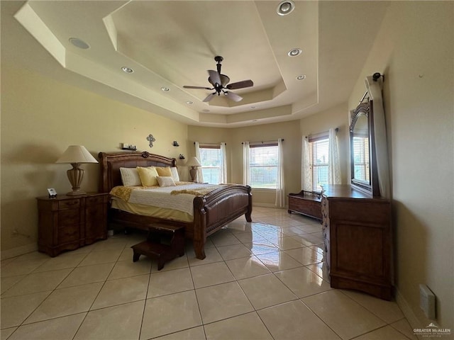 5845 Acacia St, Harlingen, TX 78552 - bedroom featuring a tray ceiling, baseboards, light tile patterned flooring, a ceiling fan, and recessed lighting