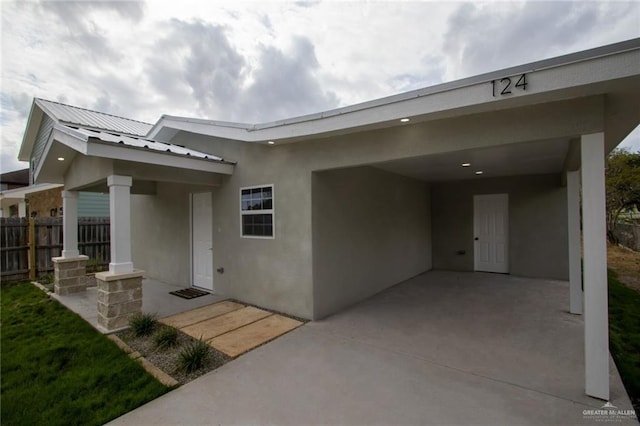 property entrance with a patio area