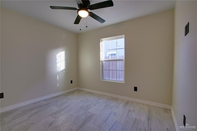 empty room featuring ceiling fan