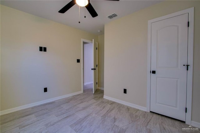 unfurnished bedroom featuring ceiling fan