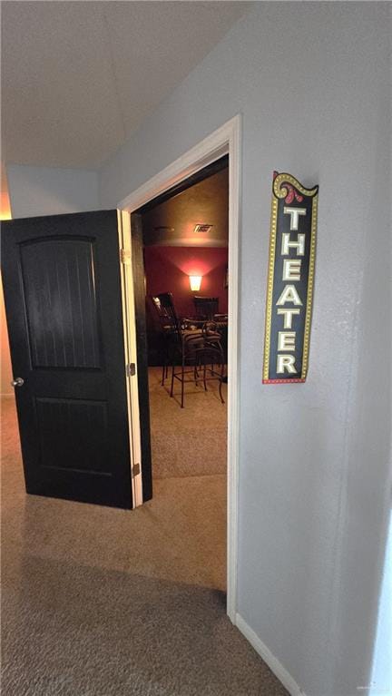 hallway featuring carpet flooring