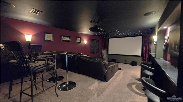 cinema room featuring carpet flooring