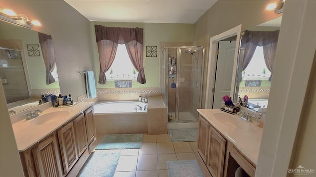 bathroom with plus walk in shower, vanity, and tile patterned floors