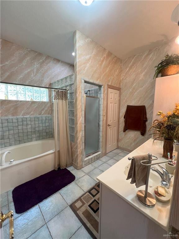 bathroom featuring tile patterned floors and separate shower and tub