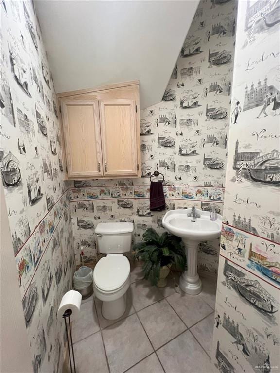 bathroom with tile patterned flooring and toilet