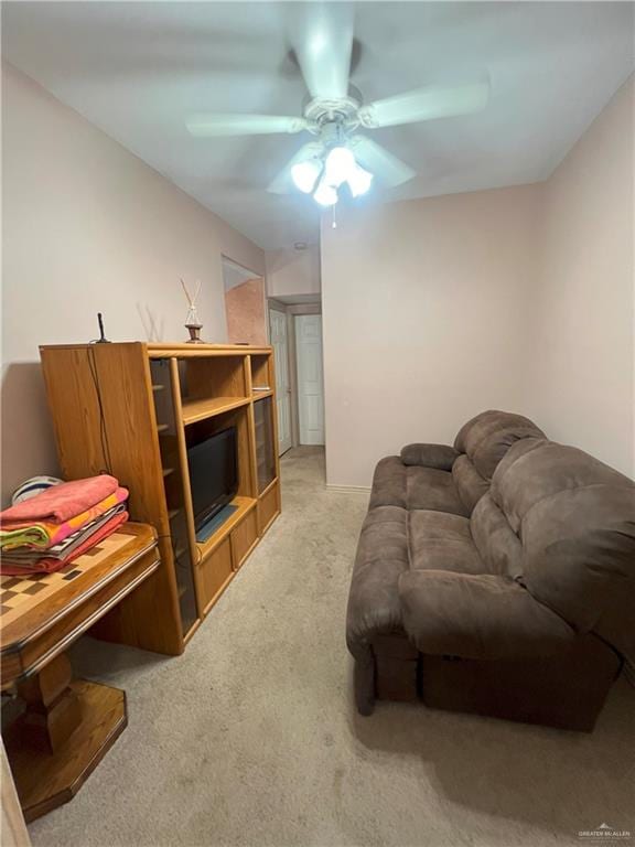 living room with light carpet and ceiling fan