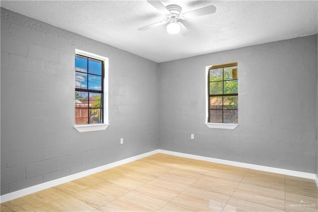 3109 Raul Gonzalez Dr, Mercedes, TX 78570 - empty room with a textured ceiling and ceiling fan
