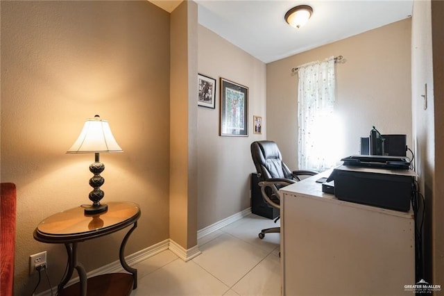 home office featuring light tile patterned flooring and baseboards