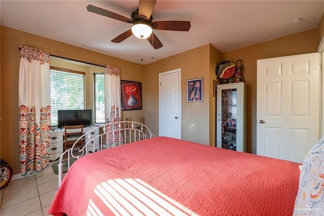 bedroom featuring tile patterned floors and ceiling fan