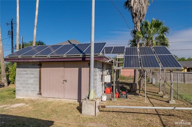view of shed featuring solar panels