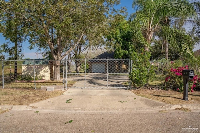 view of gate featuring fence