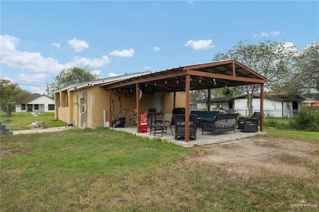 exterior space with a yard, an outdoor hangout area, and a patio area