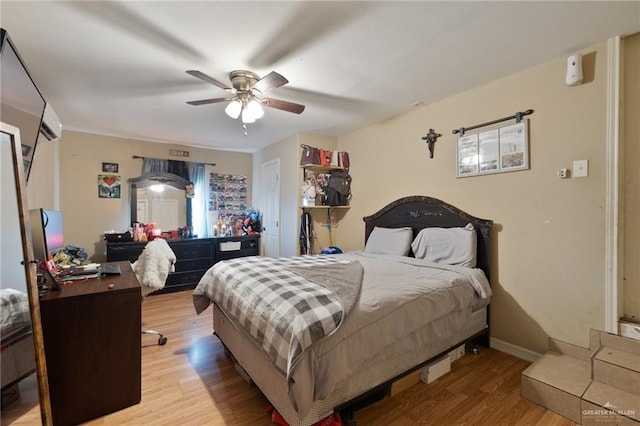 bedroom featuring ceiling fan and light hardwood / wood-style floors