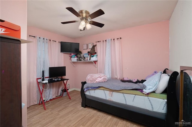 bedroom featuring ceiling fan and light hardwood / wood-style flooring