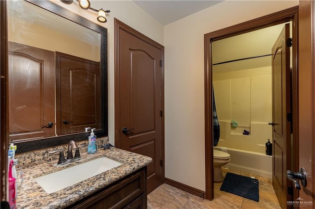 full bathroom featuring vanity,  shower combination, and toilet