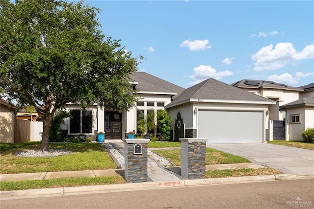 5105 August Ct, Edinburg, TX 78539 - view of front facade featuring concrete driveway, an attached garage, a front yard, and stucco siding