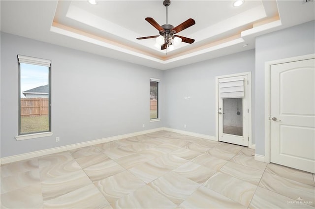 5105 August Ct, Edinburg, TX 78539 - unfurnished bedroom featuring ceiling fan, recessed lighting, and a raised ceiling