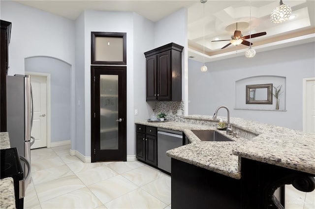 5105 August Ct, Edinburg, TX 78539 - kitchen with ceiling fan, light stone counters, a sink, and appliances with stainless steel finishes