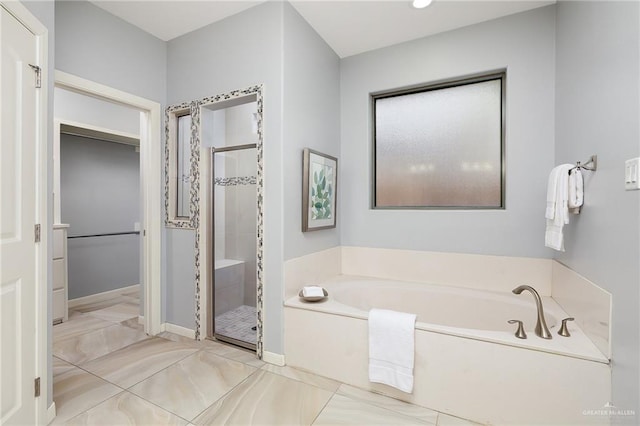 5105 August Ct, Edinburg, TX 78539 - bathroom featuring a bath and a stall shower