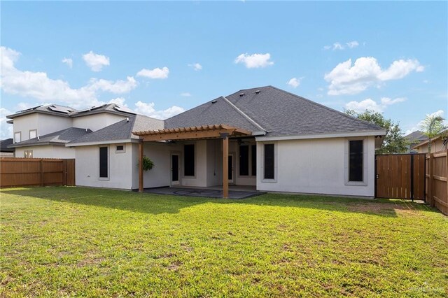 5105 August Ct, Edinburg, TX 78539 - back of house with a yard, a patio area, roof with shingles, and a fenced backyard