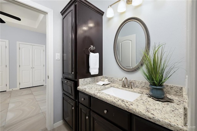5105 August Ct, Edinburg, TX 78539 - bathroom with ceiling fan, baseboards, and vanity