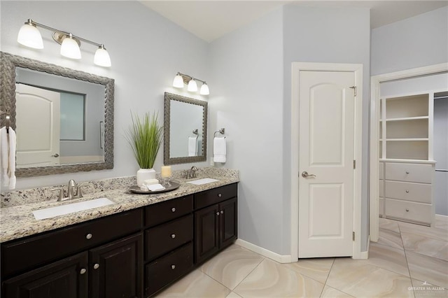 5105 August Ct, Edinburg, TX 78539 - full bathroom featuring baseboards, tile patterned floors, a sink, and double vanity