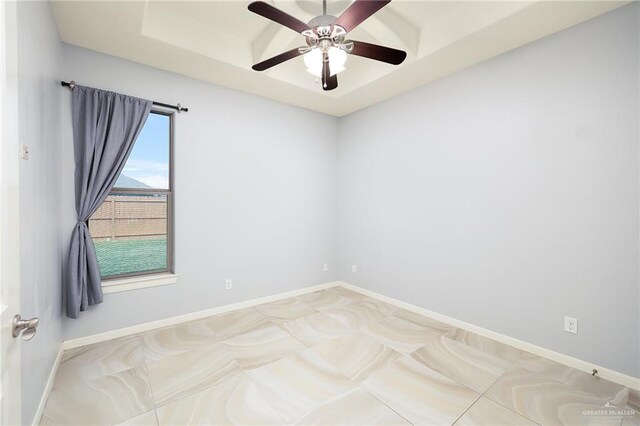 5105 August Ct, Edinburg, TX 78539 - unfurnished room featuring a raised ceiling, baseboards, and ceiling fan
