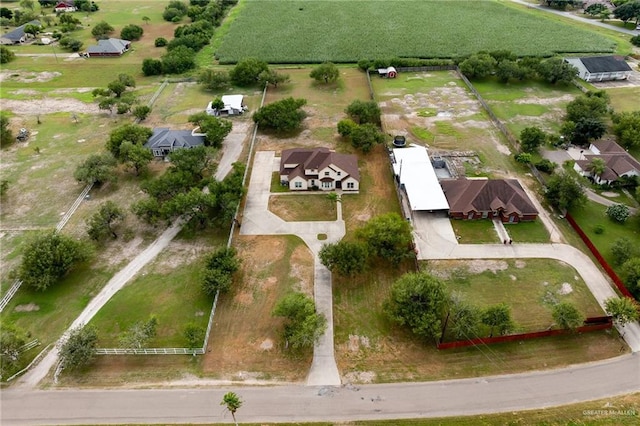 birds eye view of property with a rural view