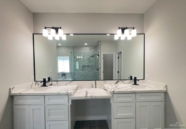 bathroom featuring vanity and an enclosed shower