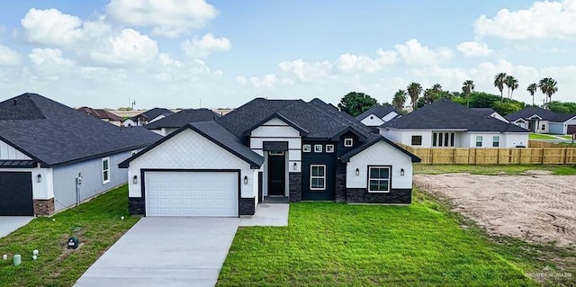 view of front of house with a garage and a front yard