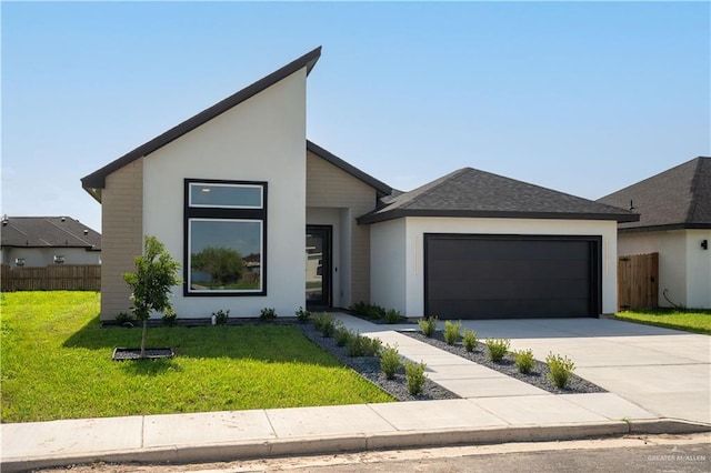 modern home with a garage and a front lawn