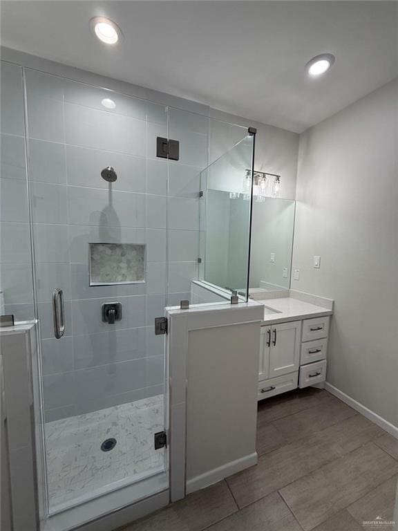 bathroom with vanity and walk in shower