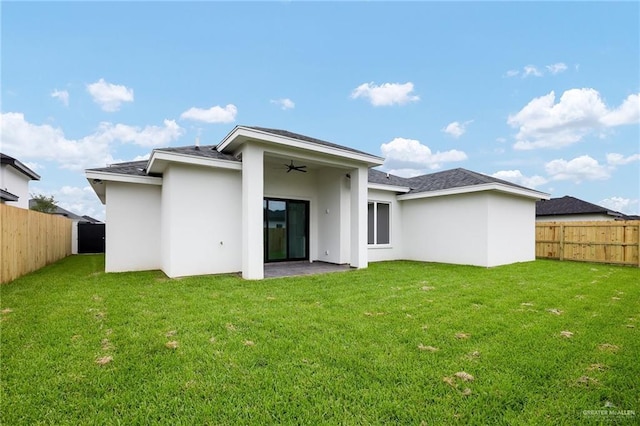 900 N Trinity St, Edinburg, TX 78541 - back of house featuring a fenced backyard, a ceiling fan, stucco siding, and a shingled roof